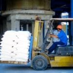 worker moving material with forklift