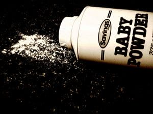 spilled baby powder next to container