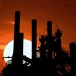 factory smoke stacks during dusk