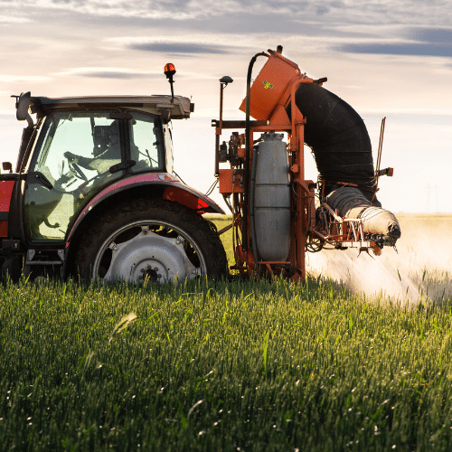 Tractor on Farm Spraying Paraquat